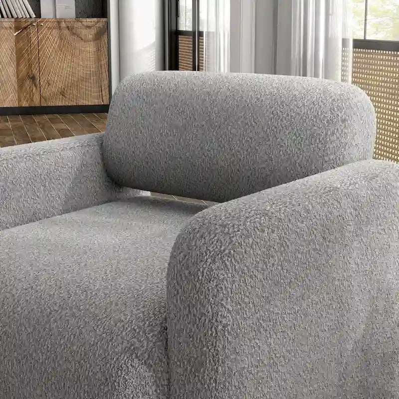 Fauteuil moderne en tissu à dossier arrondi