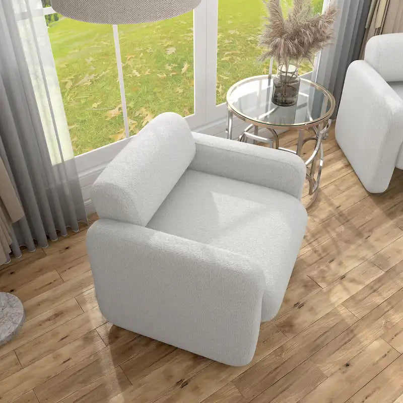 Fauteuil moderne en tissu à dossier arrondi