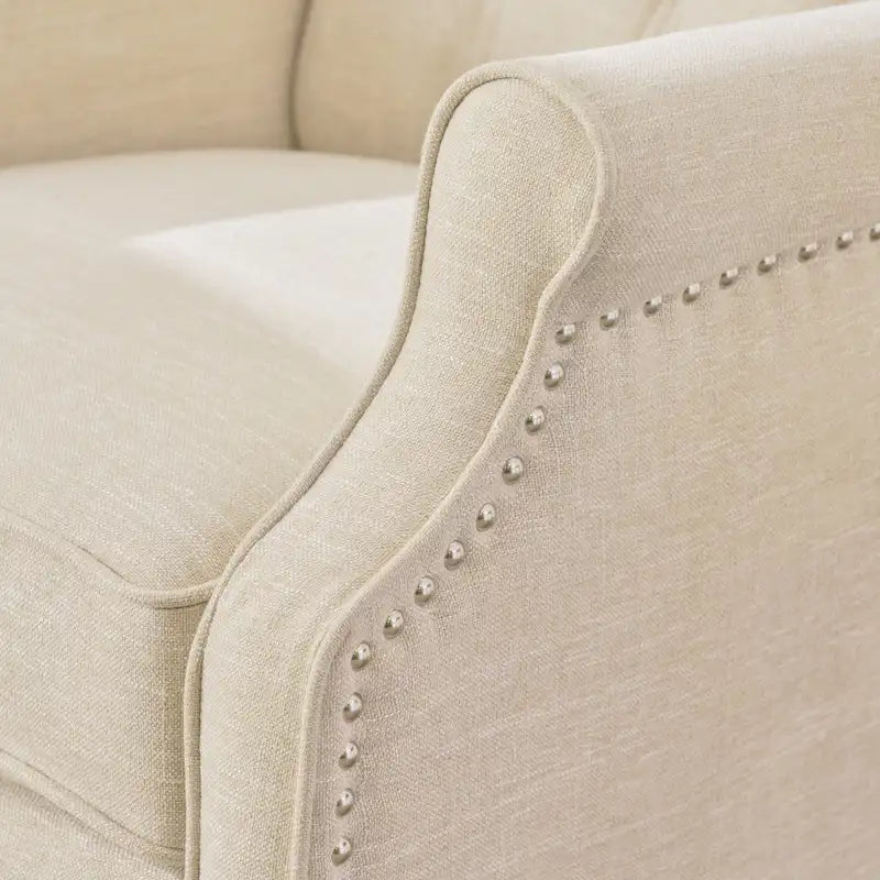 Fauteuil de salon à oreilles en tissu capitonné