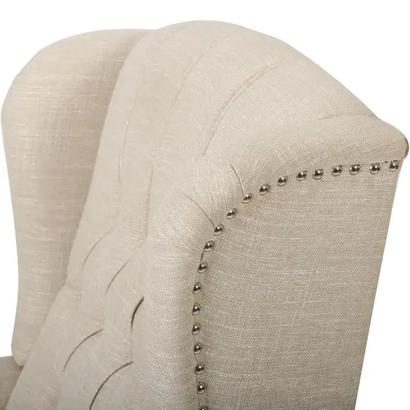 Fauteuil de salon à oreilles en tissu capitonné