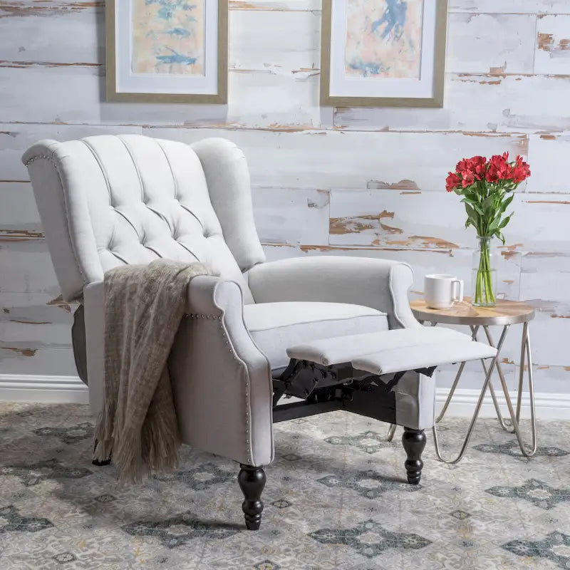 Fauteuil de salon à oreilles en tissu capitonné