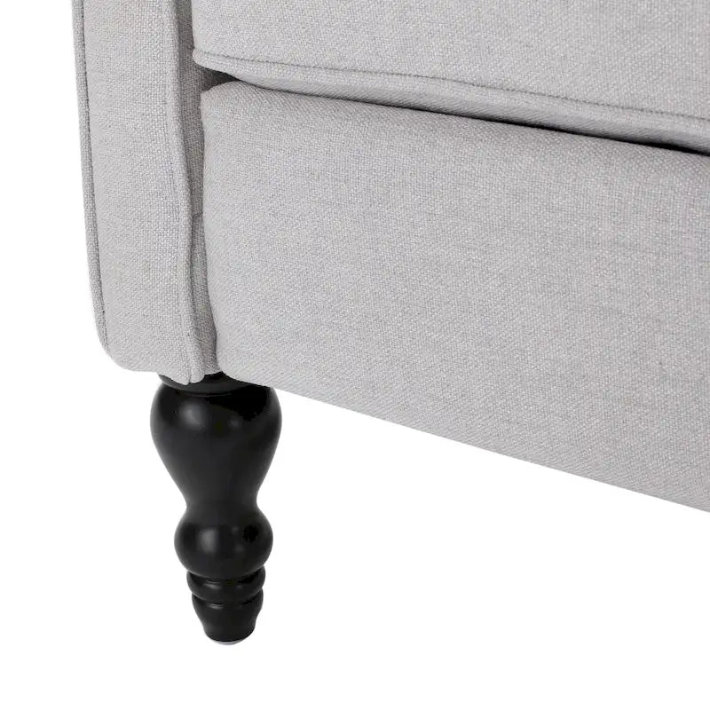 Fauteuil de salon à oreilles en tissu capitonné