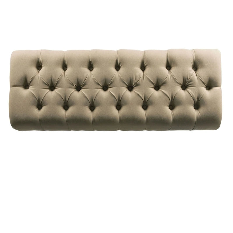 Banc capitonné, orné de rivets